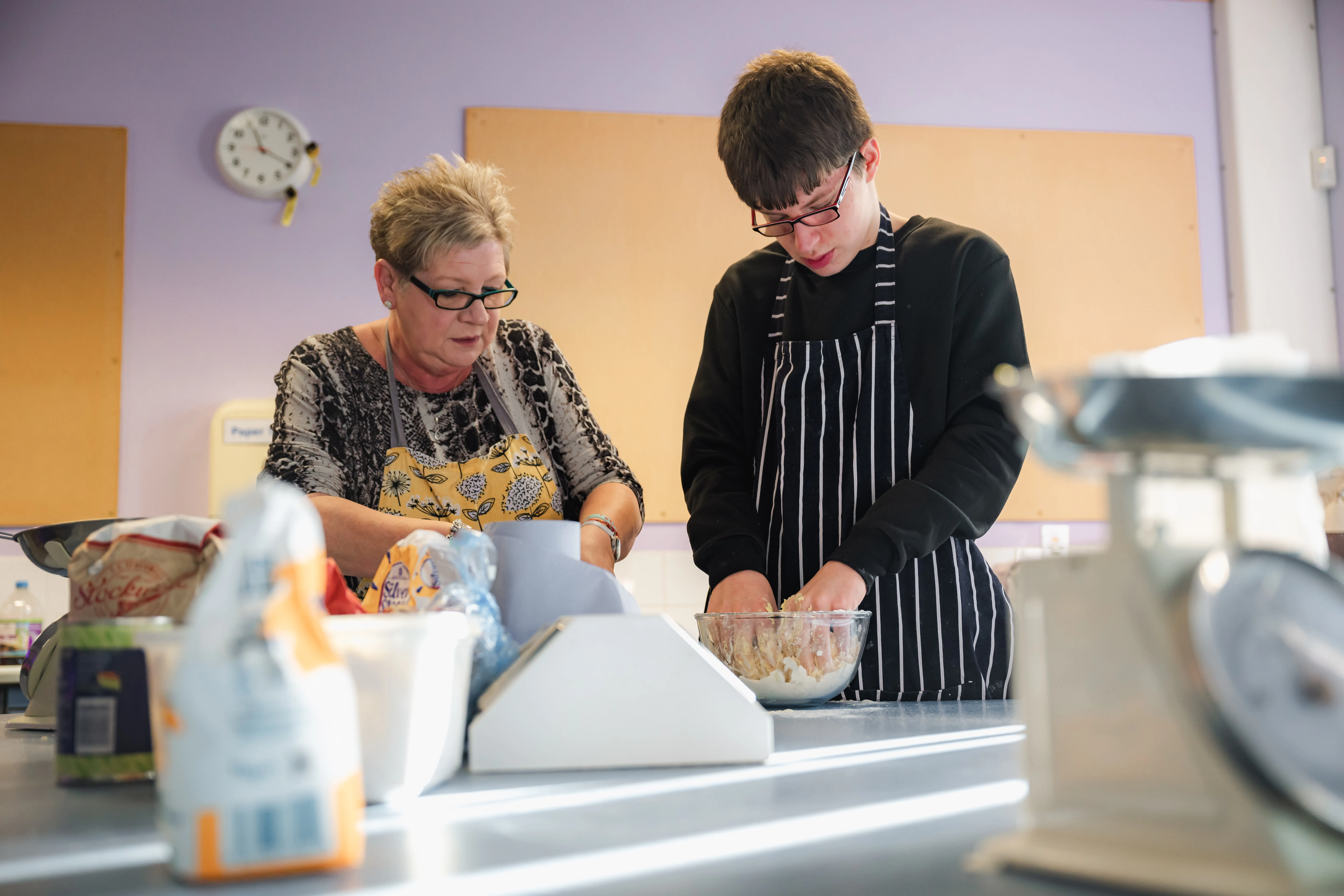 Student and teacher in food tech lesson